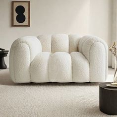 a living room with a white couch and coffee table in front of a large window