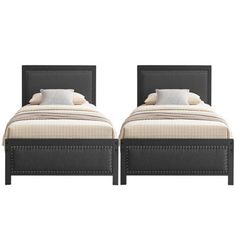 two beds sitting next to each other on top of a white floor