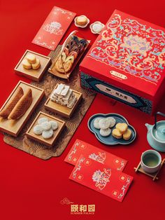 a red table topped with lots of food