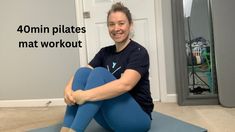 a woman sitting on a yoga mat with the words 40 min pilates mat workout