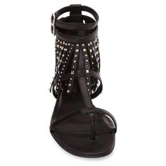 Shiny mixed-metal studs punctuate the waterfall of fringe atop an edgy strappy sandal shaped from supple calfskin leather and topped with twin ankle straps. 1/2" flat covered heel. Open toe with thong strap. Fringe ankle cuff with two buckled straps. Padded leather footbed. Leather lining and sole. Leather 100% Made in Italy Party Leather Sandals With Spikes, Leather Sandals With Spikes For Party, Leather Open Toe Sandals With Spikes, Edgy Studded Open Toe Sandals, Leather Sandals With Spikes And Open Heel, Edgy Leather Evening Sandals, Edgy Leather Sandals For Evening, Studded Leather Open Heel Sandals, Studded Leather Sandals With Open Heel