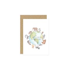 a greeting card with an illustration of animals and the words welcome to the world on it