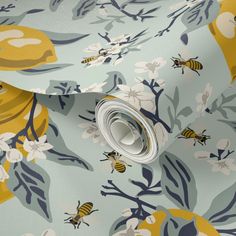 a blue and yellow floral wallpaper with bees on it