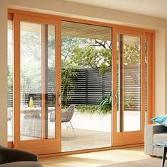 a living room filled with furniture and sliding glass doors