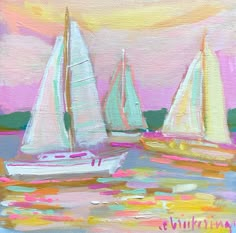 three sailboats are sailing in the water on a pink and yellow day with clouds