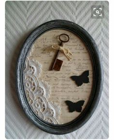 an image of a key and butterflies in a frame