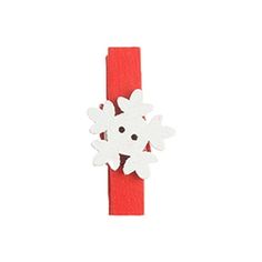 a red and white snowflaker on top of a piece of paper