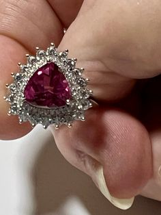 Gemstone: genuine natural trilliant cut hot pink topaz Size of stone: 9mm x 9mm x 7mm Weight: 3.30cts approx Accent stones: round cut white topaz Metal: .925 stamped Sterling Silver, rhodium plated Size: adjustable 7 1/2 to 9 1/2 Ring weigth: 4.4g Smoky Topaz, Pink Topaz, Topaz Earrings, Sterling Silver Dangle Earrings, Silver Earrings Dangle, White Topaz, Adjustable Ring, Smoky Quartz, Adjustable Rings