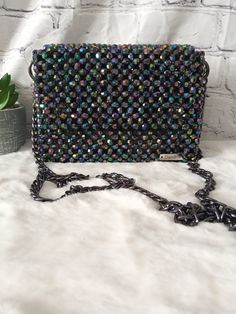 Dazzling nights call for an exquisite companion. This beaded evening bag adds the perfect touch of glamour to your ensemble. Dimension: Width: 18cm Height: 13cm Depth: 6cm The bag comes with two detachable handles. Feel free to contact me for any questions. Multicolor Rhinestone Evening Bag For Party, Elegant Multicolor Bags For Night Out, Glamorous Multicolor Evening Bag, Elegant Multicolor Evening Bag With Chain Strap, Formal Multicolor Embellished Shoulder Bag, Glamorous Beaded Bags For Night Out, Multicolor Clutch With Chain Strap For Party, Glamorous Beaded Evening Bag, Multicolor Rhinestone Shoulder Bag For Party