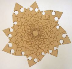 a piece of cardboard cut out to look like a flower with circles and hearts on it