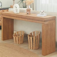 a wooden table with two baskets on it