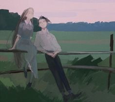 two people sitting next to each other on a fence in front of a field with mountains