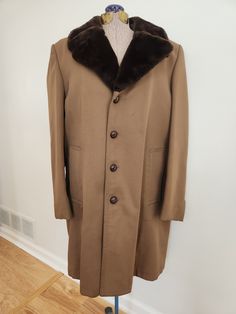 This vintage coat is sure to keep you cozy during the winter months. London Fog Outerwear of Distinction Londontown Corporation, Baltimore The brown coat has a faux fur collar and is lined with the same fabric. There are two exterior pockets Tag size: 38 Reg. Shoulder to hem length: 33.75 inches Sleeve length: 24.5 inches Chest: 45 inches There are a few spots of little pilling/pulls and there is some minor staining (see last photo). The coat is otherwise in good vintage condition with some wear 1960s Style, Vintage London, Brown Coat, London Fog, 1960s Fashion, Vintage Coat, Faux Fur Collar, Winter Months, Fur Collar