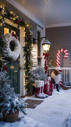 the front porch is decorated for christmas with stockings and candy canes