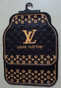 the louis vuitton bag is hanging on the wall