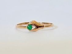 Vintage Gold and Emerald Hand Ring 14k - Etsy Formal 14k Gold Emerald Birthstone Ring, Vintage 14k Yellow Gold Emerald Ring, Formal 14k Gold Emerald Ring With Diamond, Dainty Emerald Ring For Formal Occasions, Vintage Solitaire Emerald Ring For Formal Occasions, Dainty Yellow Gold Emerald Ring For Formal Occasions, Dainty Emerald Cut Emerald Ring For Formal Occasions, Dainty Emerald Birthstone Ring For Formal Occasions, Vintage 14k Gold Green Emerald Ring