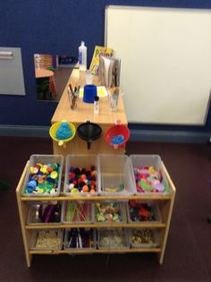 a child's craft table with toys on it