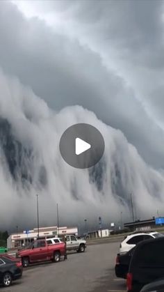 the clouds are rolling in and over the parking lot