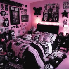 a bedroom decorated in pink and black with pictures on the wall