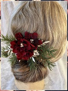 Looking for an elegant yet chic wedding hairstyle for winter? Try a sleek updo with satin ribbons. Christmas Themed Wedding Dress, Winter Wedding Poinsettia, Winter Wedding Hair Accessories, Christmas Wedding Boutonniere, Christmas Wedding Ideas On A Budget, December Wedding Flowers, Yule Wedding, Christmas Wedding Hair, Christmas Wedding Dress