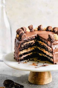 a chocolate cake on a plate with one slice cut out