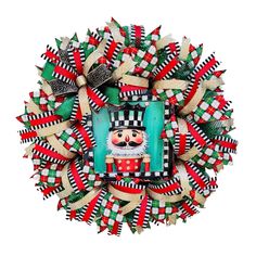 a christmas wreath with an image of a nutcracker on the front and sides