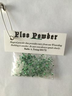 a bag of green and white glitter next to a tag that says elo power