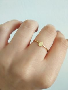 14K 9K Gold Tiny Teardrop Ring, Delicate gold ring, Dainty teardrop ring, Everyday gold ring, Minimal gold ring, Stacking ring, Boho ring, Gift for her, Stackable gold ring, 14K rose gold ring, FREE EXPRESS SHIPPING Dainty 14K or 9K solid gold ring with a tiny teardrop. A beautiful, versatile ring to wear it alone or stack it with others! More dainty gold rings here: https://www.etsy.com/shop/WhisperGold?ref=seller-platform-mcnav&section_id=23760120 ------------------------------------------ Minimalist Teardrop Ring For Everyday, Minimalist 14k Gold Teardrop Ring, Delicate Teardrop Ring For Gifts, 14k Gold Teardrop Ring, Minimalist Teardrop Gold Ring, Dainty Gold Pear-shaped Ring, Dainty Teardrop Gold Ring, Minimal Gold Ring, Gold Ring Stacking