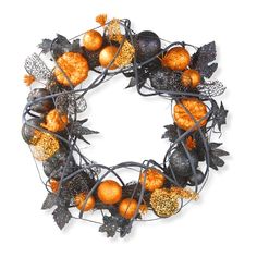 a wreath with oranges and leaves is shown on a white background for use as an ornament