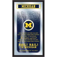 the michigan wolverines football ticket frame is shown in blue and gold with an inscription that reads