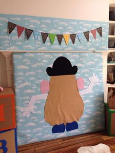 a child's room decorated in blue and white with an image of a man on the wall