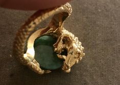 "Vintage Estate 14K 16.3 g Dragon Eating Green Jade Ring. Size: 9. Jade- 3/4\"x1/2\". Markings: 14K ( Ring was resized so the mark have been partially erased but still show partial markings). Amazing large piece. Dragon represent luck. Dragon eating jade signifies abundant wealth, luck and good health attained. Beautiful Details. Sold as is. Pre- Owned." Dragon Protecting, Abundant Wealth, Luck Dragon, Azurite Ring, Eating Green, Green Jade Ring, Green Eating, Jade Ring, Fish Bone