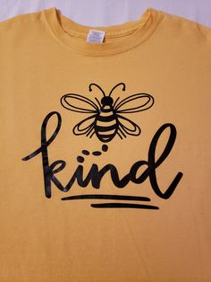 Super cute "Bee Kind" unisex t-shirt.  What a great reminder to everyone who sees it!  Would make a great gift for someone special. Bee Shirt Ideas, Be Kind Tshirts, Bee Tshirt, Bee Shirts Women, Bee Kind Shirts, Fall Tees, Bee Shirt, Yellow Bee, Diy Shirts