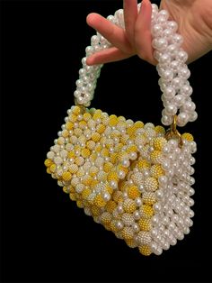 Handbag - Beaded white and yellow bag 100% handmade Material: acrylic beads Size: > width - 19 cm > height - 10 cm (20 cm with handle) > lateral width - 6 cm  The bag has removable handles, one on top and a chain over the shoulder Yellow Beaded Bag For Gift, Yellow Beaded Party Bag, Elegant Yellow Beaded Bag, Yellow Beaded Rectangular Bag, Yellow Beaded Bag For Everyday Use, Elegant Handmade Yellow Shoulder Bag, Elegant Yellow Handmade Shoulder Bag, Pearl Handbag, Bead Bag