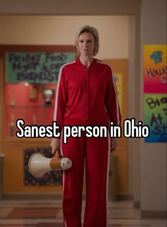 a woman in red jumpsuits holding a white bucket with the words, sanest person in ohio