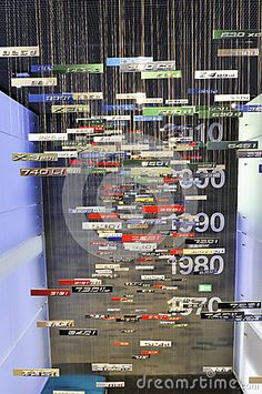 an art installation made out of many different types of wires and numbers hanging from the ceiling