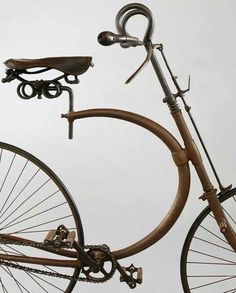 an old fashioned bicycle is shown in the air