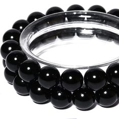 PRICES MAY VARY. Material: Natural Black Onyx with Highly Polished, Smooth, Shiny Surface Size: Bead size 6-10mm,Hole Size 1mm；Crystal Stretch Cord:33 ft(2m). 6mm,1 Strand(15 inches / Strand; 63 pcs / Strand) 8mm,1 Strand(15 inches / Strand; 45 pcs / Strand) 10mm,1 Strand(15 inches / Strand; 38 pcs / Strand) WIDE USAGE: Loose Gemstone Are Excellent for Beading, Jewelry Making, Jewelry Design, DIY gifts, Arts & Craft, Necklaces, Bracelets, Yoga bracelets, Earrings, Ring, Home & Wedding Decoration Obsidian Beaded Bracelets With Black Beads, Black Obsidian Beaded Bracelets, Black Onyx Gemstone Beads, Black Beaded Bracelets With Polished Beads, Black Round Beads Bracelets For Party, Black Polished Beads Bracelet, Black Onyx Round Beads, Black Gemstone Beads For Jewelry Making, Black Gemstone Round Beads