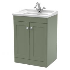 an image of a bathroom sink with cabinet and faucet on the side in green