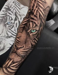 a tiger with blue eyes on the arm