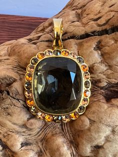 "Gorgeous Vintage Joan Rivers Oval Pendant. Adorned with blue, gold, and brown glass rhinestones in a gold-tone setting, it exudes timeless charm and adds a touch of elegance to your ensemble. The combination of colors and materials makes it a bright and beautiful accessory that complements your unique sense of style. Signed on back.  Approx Measurements 2\" Tall 1.25\" Wide Condition: Vintage Excellent. Sold as is.   PLEASE review all pictures closely.  Contact me with any questions or problems with your order. Thank you for shopping in my store.  International buyers please contact me for shipping details and cost. Most of my items are vintage and used, they will all show some signs of light wear or use.   Major flaws will be noted in the description.  Items are sold \"as is\" so please Necklaces Etsy, Oval Pendant Necklace, Art Deco Pendant, Joan Rivers, Oval Pendant, Glass Pendant, Glass Pendants, Brown Gold, Blue Gold