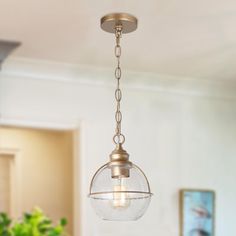 a light fixture hanging from the ceiling in a kitchen