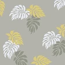 a gray and yellow wallpaper with leaves on it