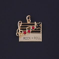 Vintage Rock N Roll Charm: Step into the mid-century with this vintage 1960s charm, featuring a music bar crafted from 14k gold adorned with heart-shaped notes in red and black enamel.  The piece measures 0.8 inches from the top of the jump ring to bottom by 0.7 inches wide and weighs 1.87 grams. It is in great condition. Upon purchase, your charm will arrive elegantly packaged, ready for gifting or as a special treat for yourself.  We carefully wrap each piece to ensure a delightful unboxing experience. We also offer free and flexible layaway plans, so take advantage of this option to make owning your dream piece even more achievable. + Trademark Antiques Shop Homepage https://www.etsy.com/shop/TrademarkAntiques + Our Store Policies https://www.etsy.com/shop/TrademarkAntiques/policy?ref=s Music Bar, Bespoke Rings, Vintage Rock, Antique Shops, Rock N, Black Enamel, Vintage 1960s, Red And Black, Jewelry Findings