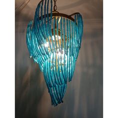 a blue chandelier hanging from the ceiling