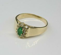 Vintage 14K Yellow Gold Emerald and Diamond Ring, 3x5mm central green emerald with diamond halo, white gold set, 3/8 inch wide, Ring size 7, Circa 1960, 2.8 grams. SKU # BB271R19 Most rings are sizable for a small fee. If the ring you are considering is the incorrect size contact us for a quote. This listing contains photographs of the actual item you will receive. Our items are in excellent condition with little or no signs of wear and many are one of a kind pre-owned estate finds. Please look Emerald And Diamond Ring, Sparkly Ring, Gold Diamond Band, White Gold Set, Wide Ring, Emerald Jewelry, Pretty Rings, Fine Jewelry Designers, Green Emerald