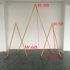 three wooden poles are shown with measurements for each pole in front of the white wall