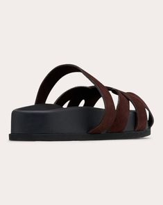 Blending luxury with laid-back appeal, the Ibor sandal encircles the foot with a series of wide suede straps to create an eclectic effect. The thick platform sole and soft insole lining offer elevated comfort. Slip-on Rounded toe Upper: 100% suede leather Lining: 50% goat leather, 50% nappa leather Insole: 100% suede Outsole: 100% micro Spot clean Made in Italy Size & Fit Platform height: 1.37in (35mm) Fits true to size Sustainability Metrics: Circular Economy: product is intentionally designed with 50% of actively cycled materials Organic Materials: at least 60% of materials used for production come from natural sources and do not contain harmful toxins or waste Craft & Community: at least 75% of products are fully sourced and manufactured within the specified community or country; 100% o Circular Economy, Goat Leather, Suede Sandals, Nappa Leather, Flat Sandals, Dark Chocolate, Suede Leather, Slip On, Sandals