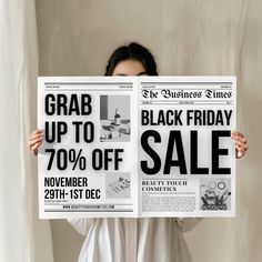 a woman holding up a black friday sale sign