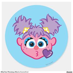 a blue plate with an image of a pink troll on it's face and purple hair